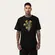 CAMISETA MCD REGULAR DOURADO MAO CAVEIRA