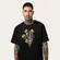 CAMISETA MCD REGULAR DOURADO MAO CAVEIRA