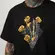 CAMISETA MCD REGULAR DOURADO MAO CAVEIRA