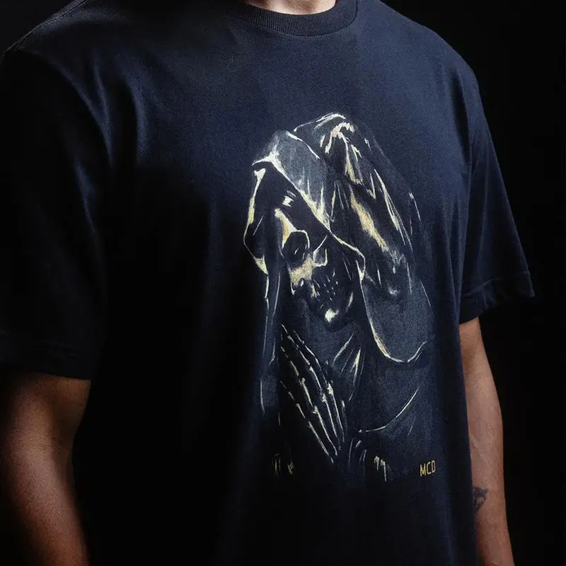 CAMISETA MCD SANTA DOURADA PRETO