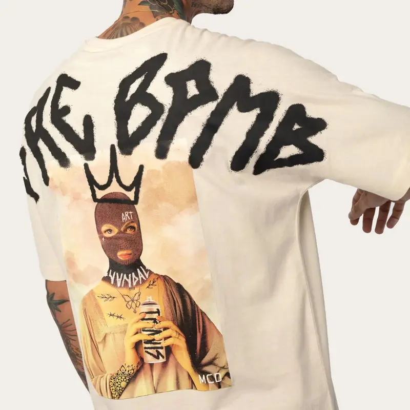 CAMISETA MCD ESPECIAL HOPE TRAVIS BOMB CREME ARCANJO